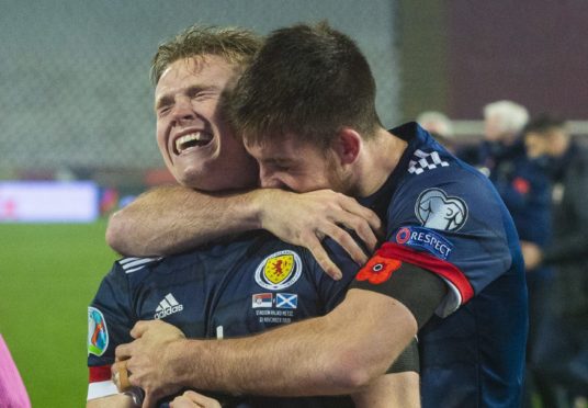 Scotland's Scott McTominay (left) and Declan Gallagher celebrate after David Marshall saves Aleksandar Mitrovic's penalty