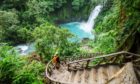 Majestic waterfall in the rainforest jungle of Costa Rica. Tropical hike.; Shutterstock ID 1007072176; Purchase Order: Sunday Post; Job: Sunday Post