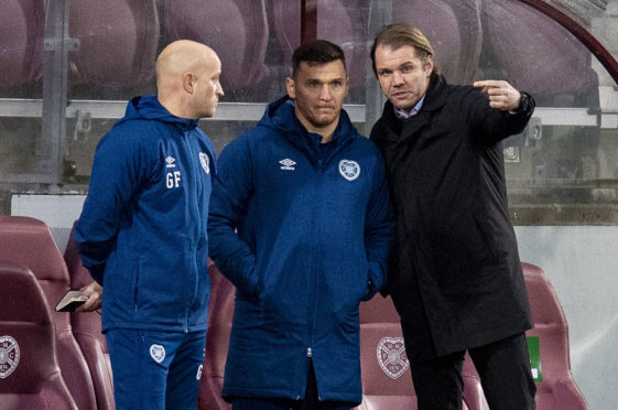 Robbie Neilson explains his thinking to his backroom staff, Gordon Forrest and Lee McCulloch