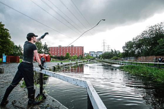 Magnet Fishing, in a canal in the Possil area of Glasgow.