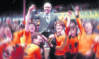 Legendary football manager Jim McLean, who died on Boxing Day aged 83, is carried high by his Dundee United players after they beat rivals Dundee 2-1 at Dens Park to clinch the league title on May 14, 1983