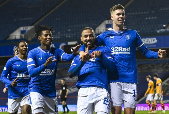 Roofe, seen celebrating one of his goals against Motherwell last Saturday, has become a big player for Rangers recently.