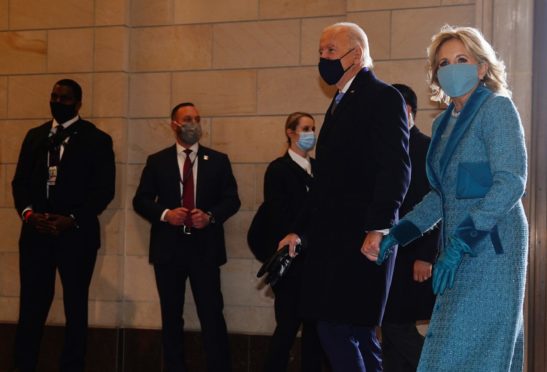 President-elect Joe Biden (L) and Dr. Jill Biden (R) arrive at the East Front of the US Capitol for his inauguration ceremony to be the 46th President of the United States.