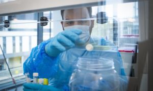 A scientist prepares a sample for Covid-19 testing at Glasgow Lighthouse facility