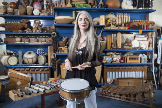 Evelyn Glennie surrounded by her vast collection of musical instruments