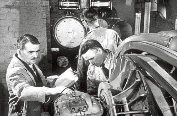 Frank Whittle, left, and colleagues work on first jet engine