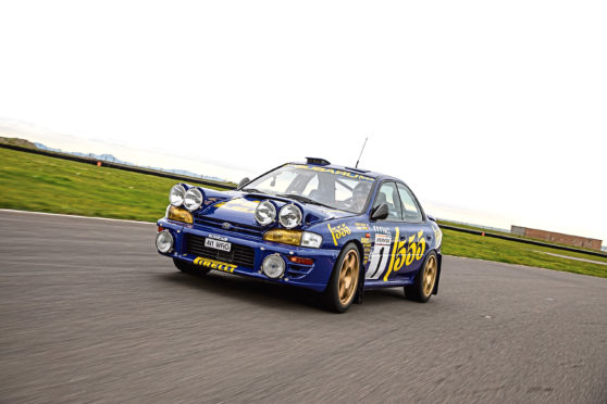 Marino Franchitti driving Colin McRae's Subaru.