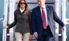 Donald and Melania Trump disembark Air Force One during their 2018 trip to the UK