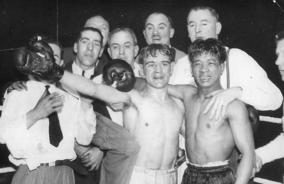 Benny Lynch, left, and rival Small Montana with their corner men after the bruising bout that made Lynch world champion without dispute