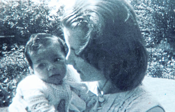 Marion, 17, cuddles her baby in the Salvation Army’s Hopedene home in 1967 before he was taken away