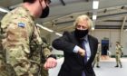 Boris Johnson meets troops setting up a vaccination centre in Castlemilk