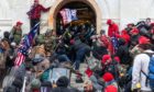 Rioters clash with police trying to enter Capitol building through the front doors