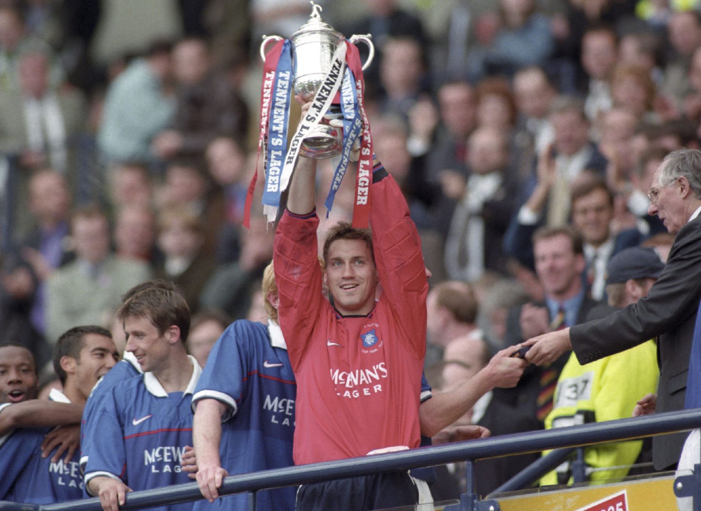 Rangers goalkeeper Stefan Klos lifts the Scottish Cup, 1999