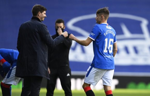 Rangers boss Steven Gerrard with starlet Nathan Patterson in happier times                        but now there’s some distance between them.