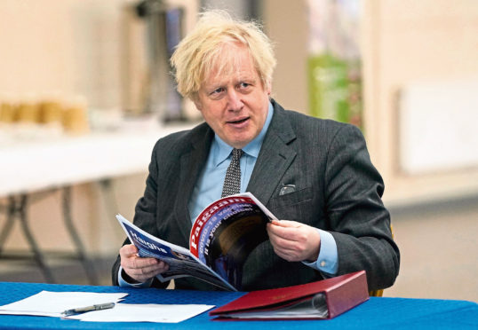 Prime Minister Boris Johnson during  a visit to a coronavirus vaccination centre in Batley, West Yorkshire.