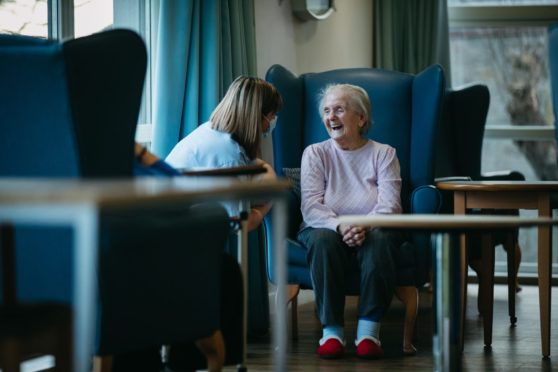 Balhousie care home resident Catherine Henderson with a carer