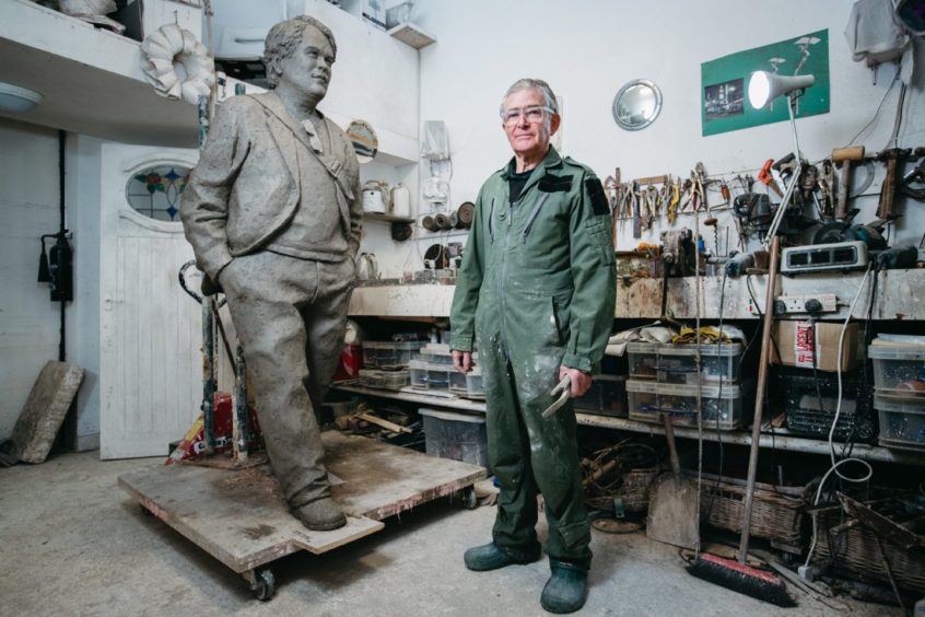 Sculptor David Annand with the statue in his workshop in Fife