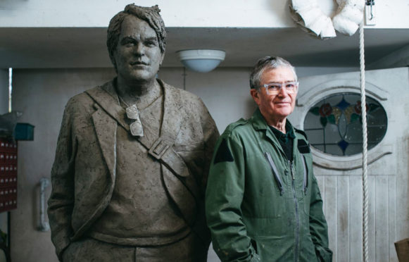 David Annand with his sculpture of actor Philip Seymour Hoffman