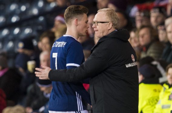 Former Scotland manager Alex McLeish with Scott McTominay (left)