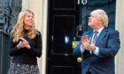 Boris Johnson taking part in the Clap for our Carers with his partner Carrie Symonds.