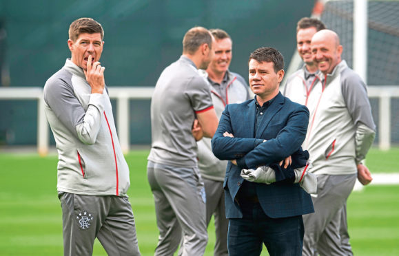 Steven Gerrard, seen with sporting director, Ross Wilson, uses slightly different 
methods to those of former Rangers manager, Jock Wallace.