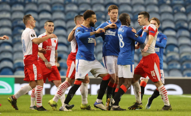 Glen Kamara, backed up by                         Connor Goldson, takes issue with Slavia Prague defender, Ondrej Kudela, at Ibrox last Thursday night.