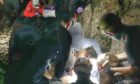 Rescue team fight on the mountainside to save Dan after he falls more than 80ft