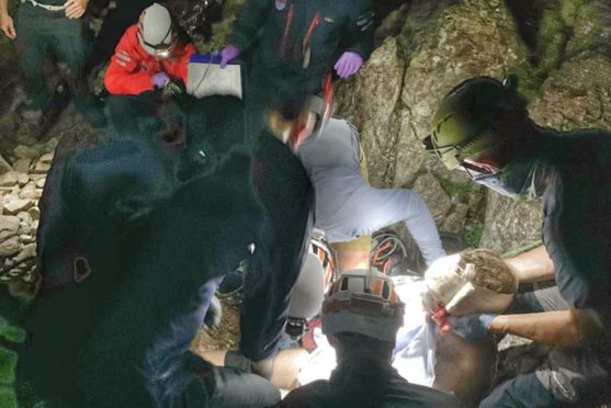 Rescue team fight on the mountainside to save Dan after he falls more than 80ft