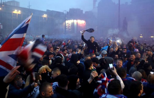 Fans celebrate in Glasgow’s George Square last Sunday after Rangers win the Scottish Premiership