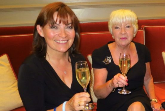 Lorraine enjoys a glass of fizz with mum Anne