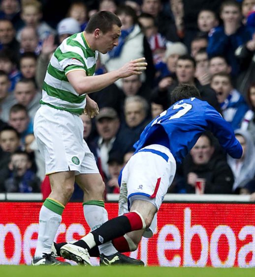 2010 – Scott Brown was sent off after this clash with Kyle Lafferty