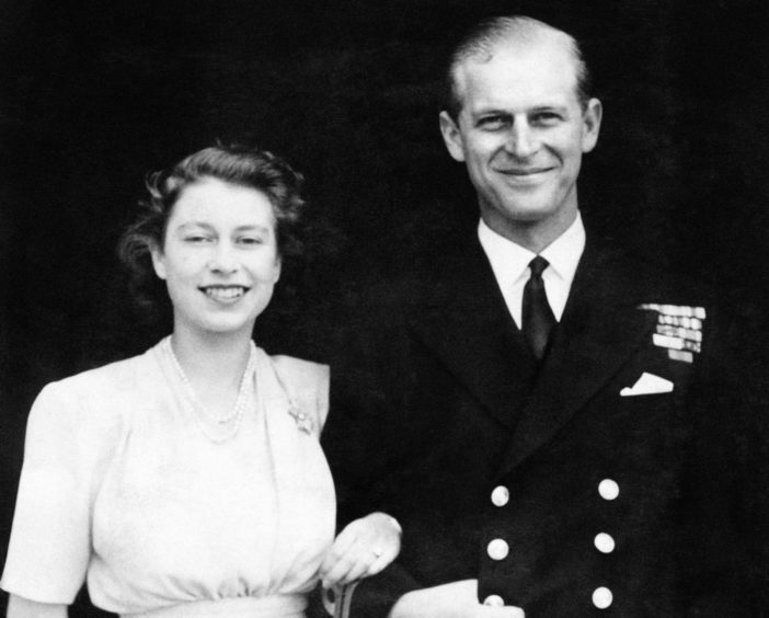 The then Princess Elizabeth and Lieutenant Philip Mountbatten posing for their first engagement pictures at Buckingham Palace.