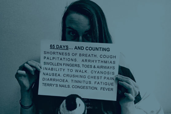 Barbara Melville, 37, who is in long-term recovery with Covid-19, shows a list of her symptoms