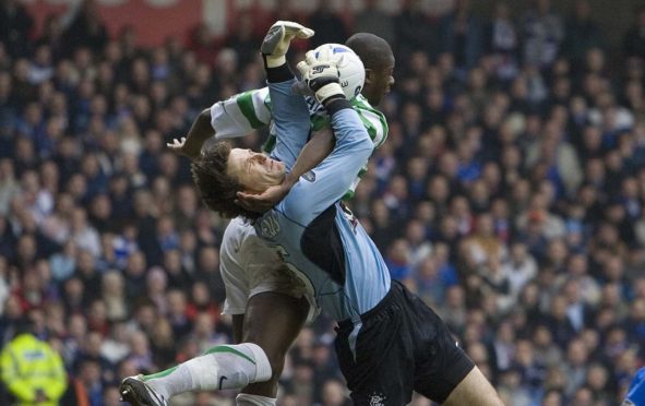 Ronald Waterreus claims this cross, despite the formidable presence of Bobo Balde, during an Old Firm game in 2006