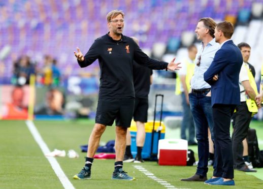 Steven Gerrard and Steve McManaman (centre) listen intently to Jurgen Klopp in full flow. But could the Rangers boss run into the same problems the German has?