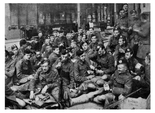 The soldiers of the London Scottish in their Hodden Grey at a French station in 1914