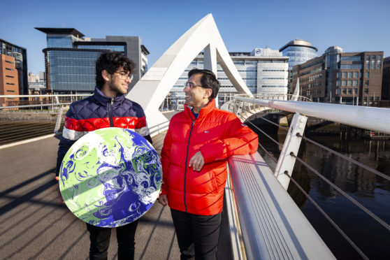 Glaswegian father and son Navneet (44) and Aayush (16), who were among those to apply.