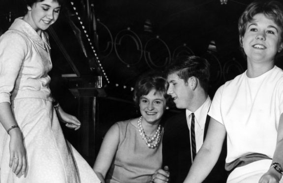 Teenage twisters Janet Mitchell, on left, and friends Maureen McGilvray and Sandra Stroyan dance at the reopening of the Locarno dancehall, in Glasgow, in September 1962