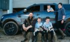Kieran and Linda McCullough with children, left to right, Rory, six, Lewis, nine, and Blair, eight, with their Ford Ranger at the family farm in Achnamara, Argyll