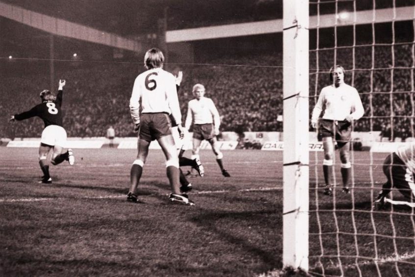 Kenny Dalgish turns and starts celebrating after scoring. Scotland v Denmark, 1972.
