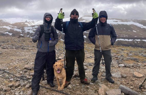 Grant, centre, with son Cameron, right, and daughter’s boyfriend Mark Shaw on Cairnwell