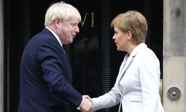 Boris Johnson shakes hands with Nicola Sturgeon outside Bute House in 2019