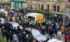 Protesters block an immigration van in Glasgow following a dawn raid in Pollokshields.