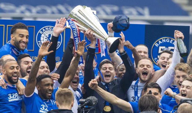 Steven Gerrard and his Rangers team lift the league trophy