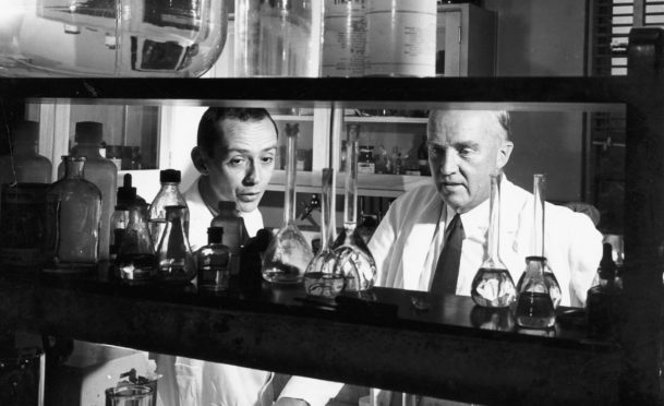 Canadian physiologist Charles Best, right, in the laboratory in 1960 with an assistant