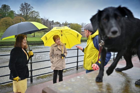 Nicola Sturgeon, centre, and Joan McAlpine on 
the campaign trail in Dumfries