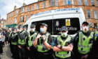 Protestors block an UK home office immigration enforcement van after an attempted raid was carried out in the morning in Kenmure Street in Pollokshields on May 13, 2021 in Glasgow, Scotland.