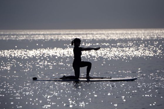 Strike a pose! Stand up paddleboard yoga in action