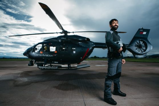 Pilot Ciar Van Holstein on the helipad at Glasgow Airport