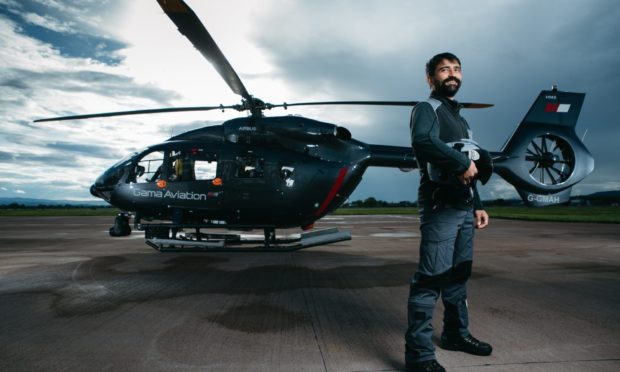 Pilot Ciar Van Holstein on the helipad at Glasgow Airport